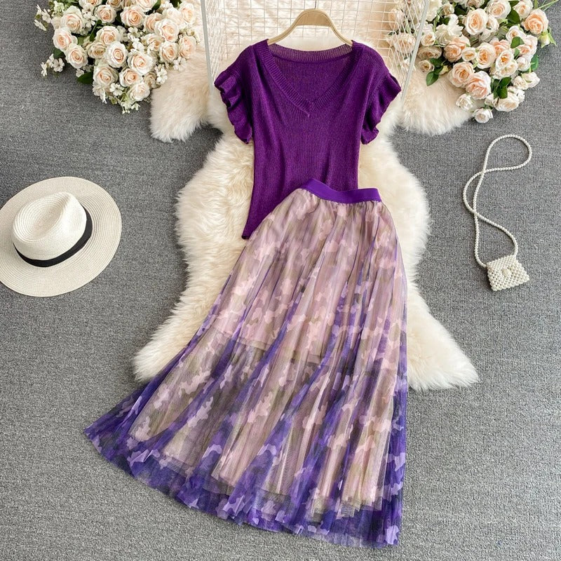 Purple V-neck top with ruffle sleeves and printed midi skirt