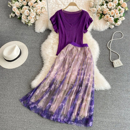 Purple V-neck top with ruffle sleeves and printed midi skirt
