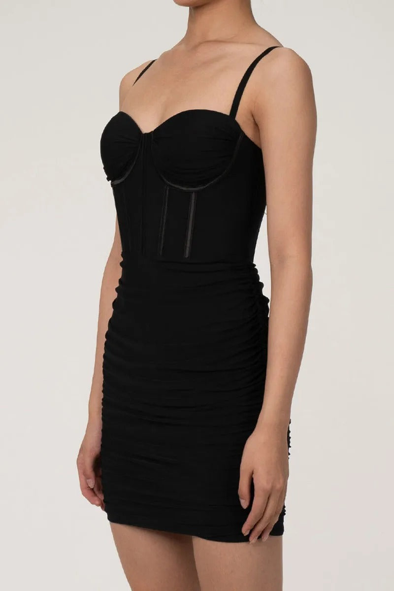 Black fitted mini dress with structured bust and straps