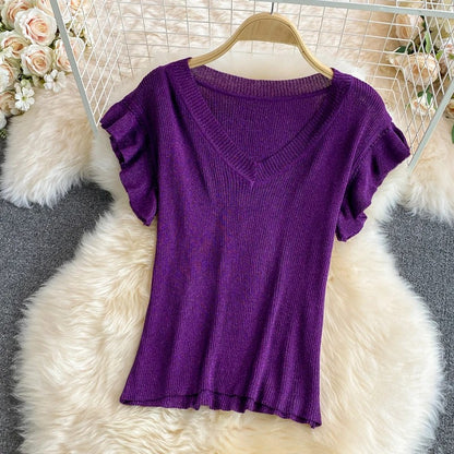 Purple V-neck top with ruffle sleeves and printed midi skirt
