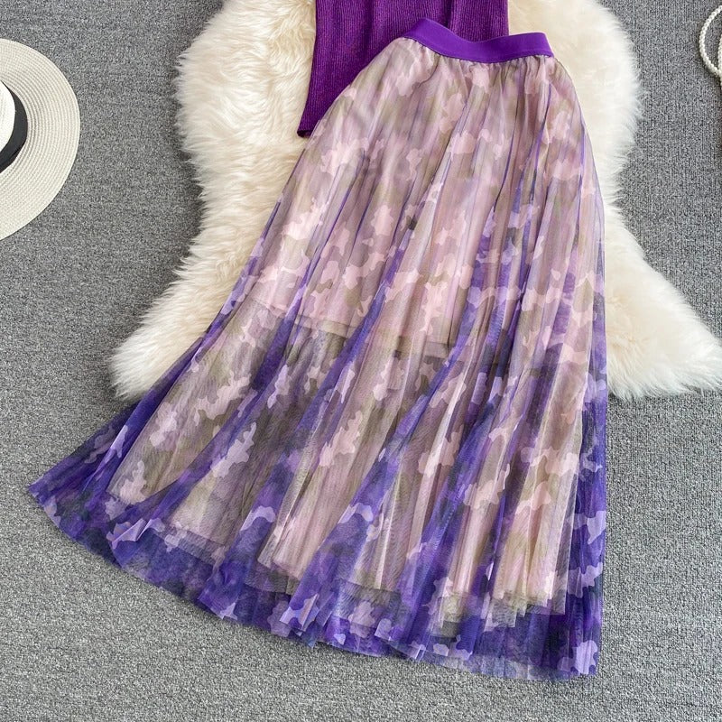 Purple V-neck top with ruffle sleeves and printed midi skirt