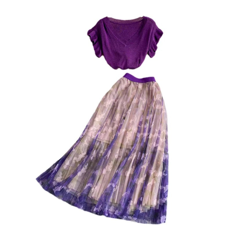 Purple V-neck top with ruffle sleeves and printed midi skirt