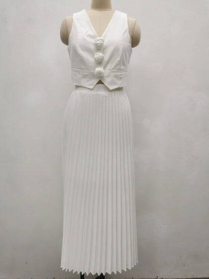 Off-white two-piece set with pleated skirt and sleeveless buttoned top